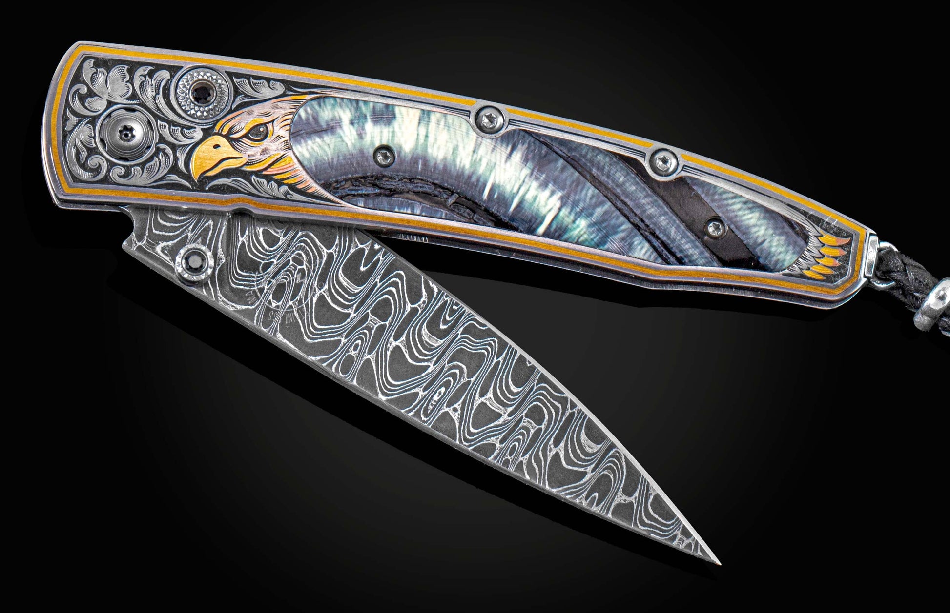 Handcrafted William Henry pocket knife featuring hand-engraved 24K & 22K gold and copper falcon, fossil Woolly Mammoth tusk, spinel gemstones, and a hand-forged damascus steel blade by Chad Norris