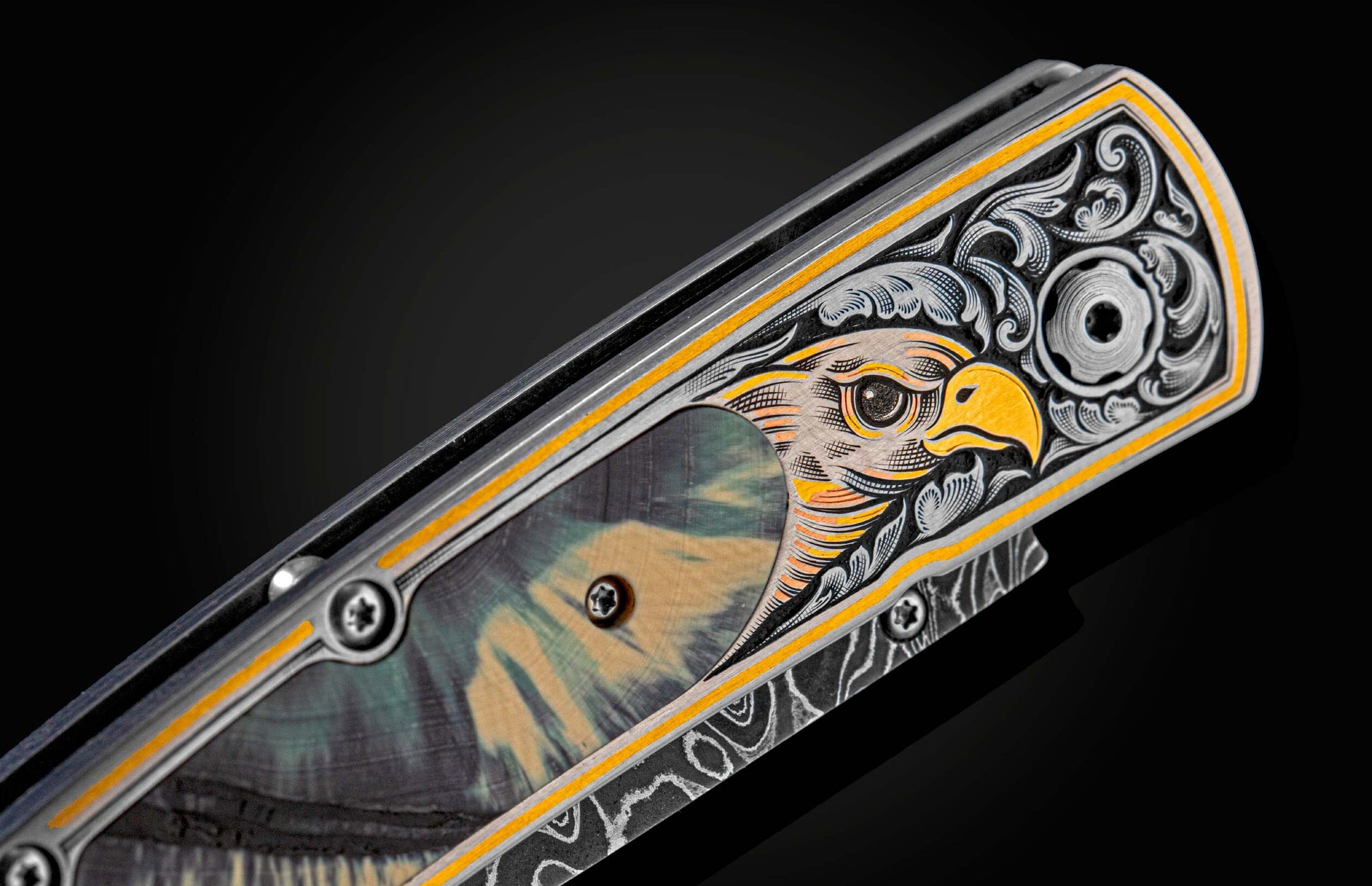 Handcrafted William Henry pocket knife featuring hand-engraved 24K & 22K gold and copper falcon