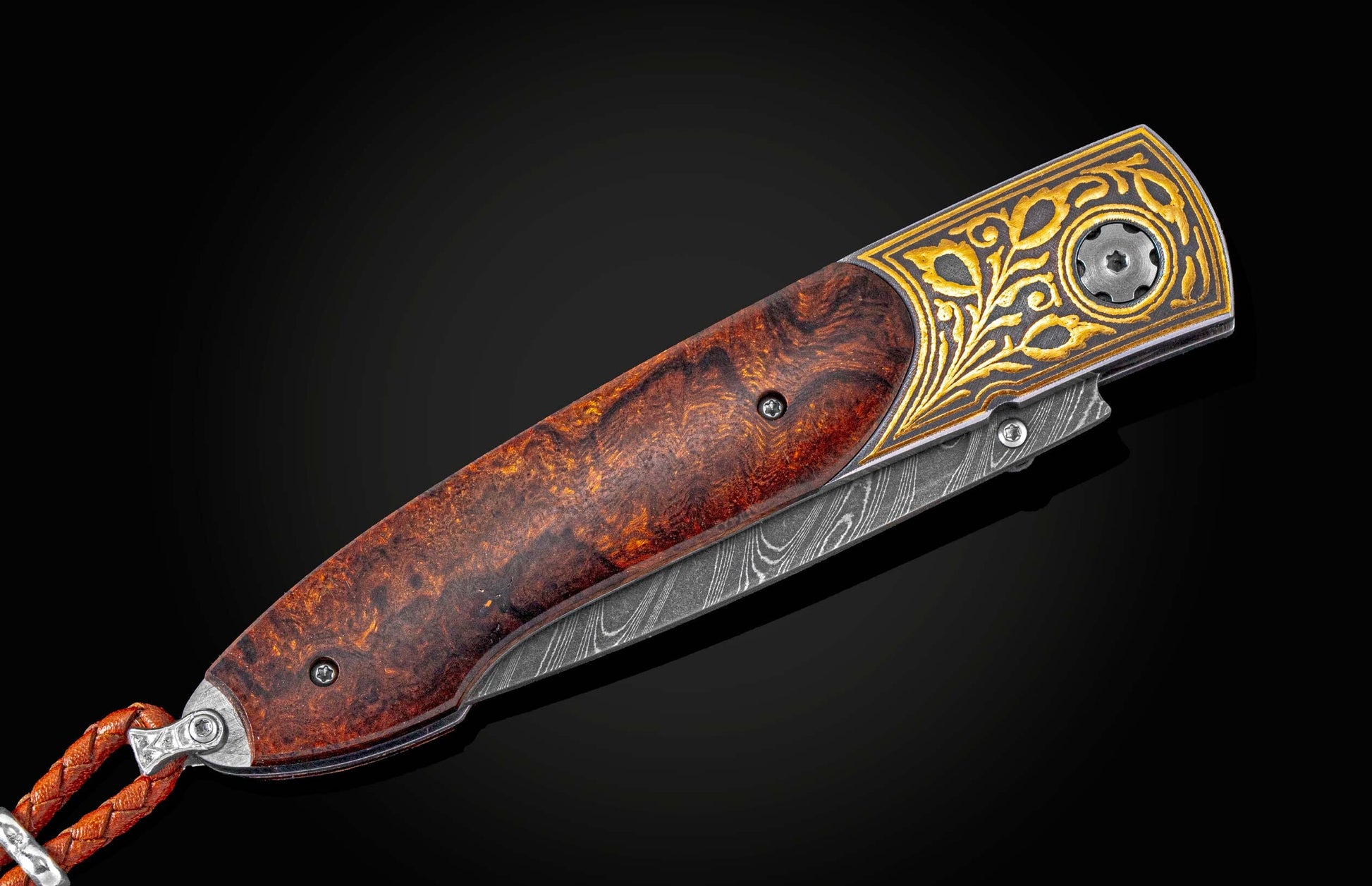 Handcrafted William Henry pocket knife featuring a 24K gold Koftgari and desert ironwood frame