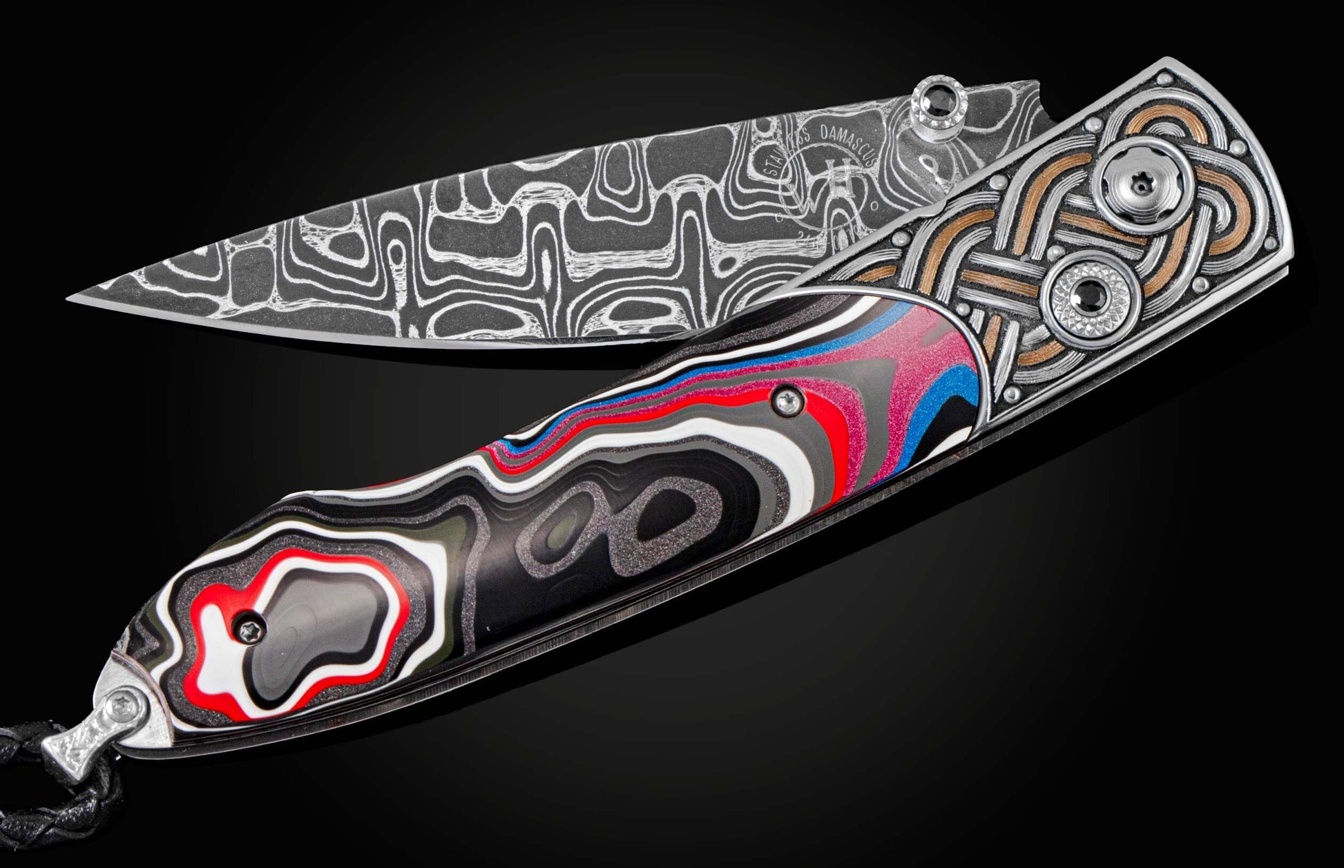 Handcrafted pocketknife from William Henry features a heat-colored, laser and hand-engraved frame inlaid with Fordite, aka Detroit Agate. The blade is hand-forged damascus steel and the button lock and the thumb stud are set with spinel gemstones.