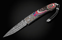  aka Detroit Agate. The blade is hand-forged damascus steel and the button lock and the thumb stud are set with spinel gemstones.