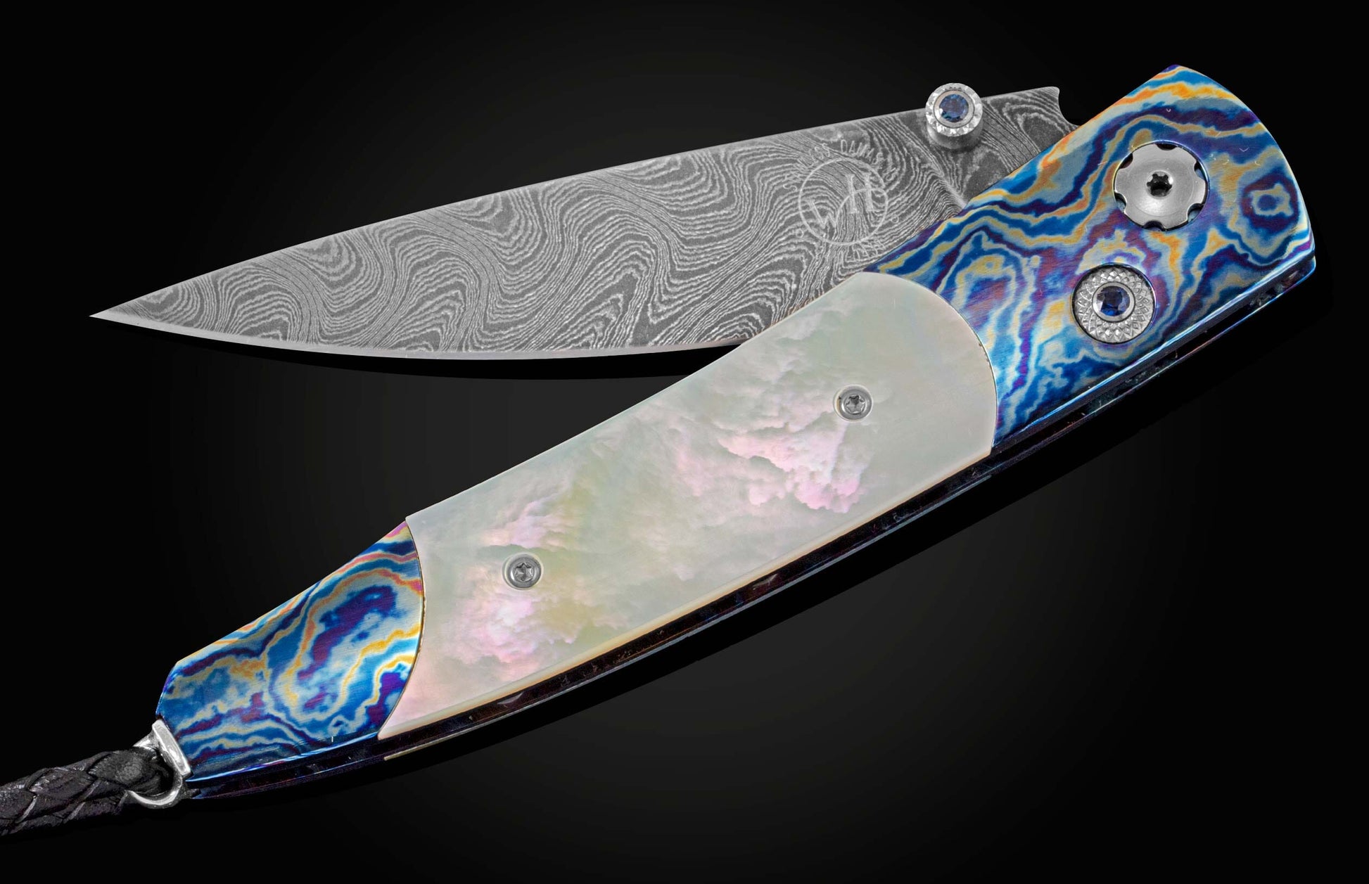 Pocket knife from William Henry featuring a hand forged Damascus steel blade and a frame of hand-forged Ukrainian 'Moku-ti' Damascus, inlaid with Gold Lip Pearl scales. The knife is shown partially open on a black background.
