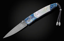 Pocket knife from William Henry featuring a hand forged Damascus steel blade and a frame of hand-forged Ukrainian 'Moku-ti' Damascus