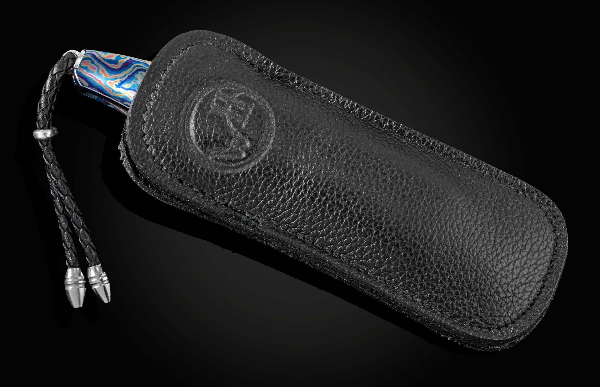 Pocket knife from William Henry featuring a hand forged Damascus steel blade and a frame of hand-forged Ukrainian 'Moku-ti' Damascus