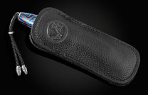 Pocket knife from William Henry featuring a hand forged Damascus steel blade and a frame of hand-forged Ukrainian 'Moku-ti' Damascus