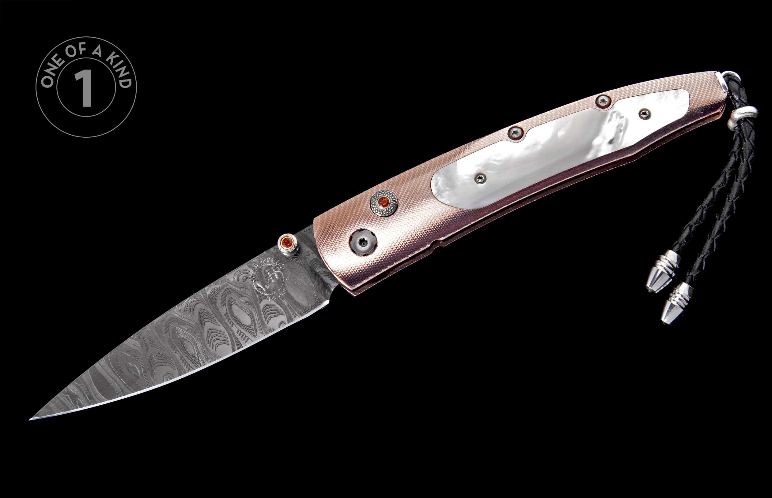 Damascus folding knife with rose gold textured handle, mother-of-pearl inlay, red gemstone accents, and braided lanyard.