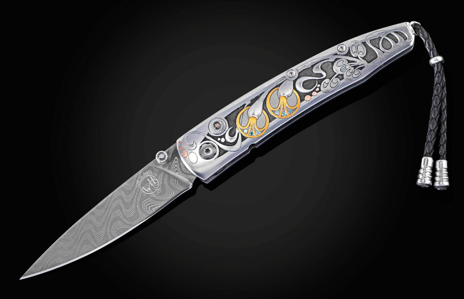 Hand forged Damascus steel blade pocket knife from William Henry features a beautiful hand-engraved frame with inlaid 14K rose gold