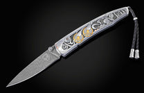Hand forged Damascus steel blade pocket knife from William Henry features a beautiful hand-engraved frame with inlaid 14K rose gold