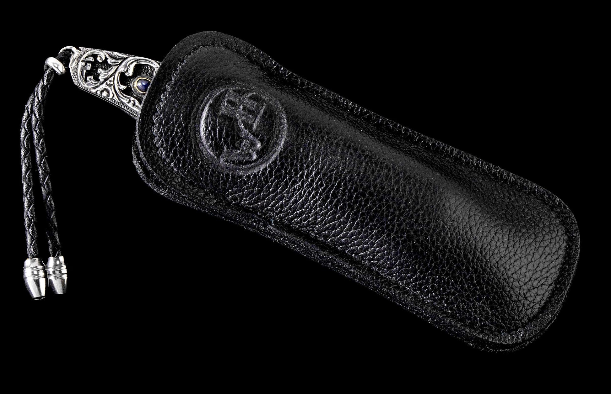 The Radiant Hand-Carved Sterling Silver Pocketknife in a leather case