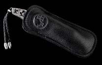 The Radiant Hand-Carved Sterling Silver Pocketknife in a leather case