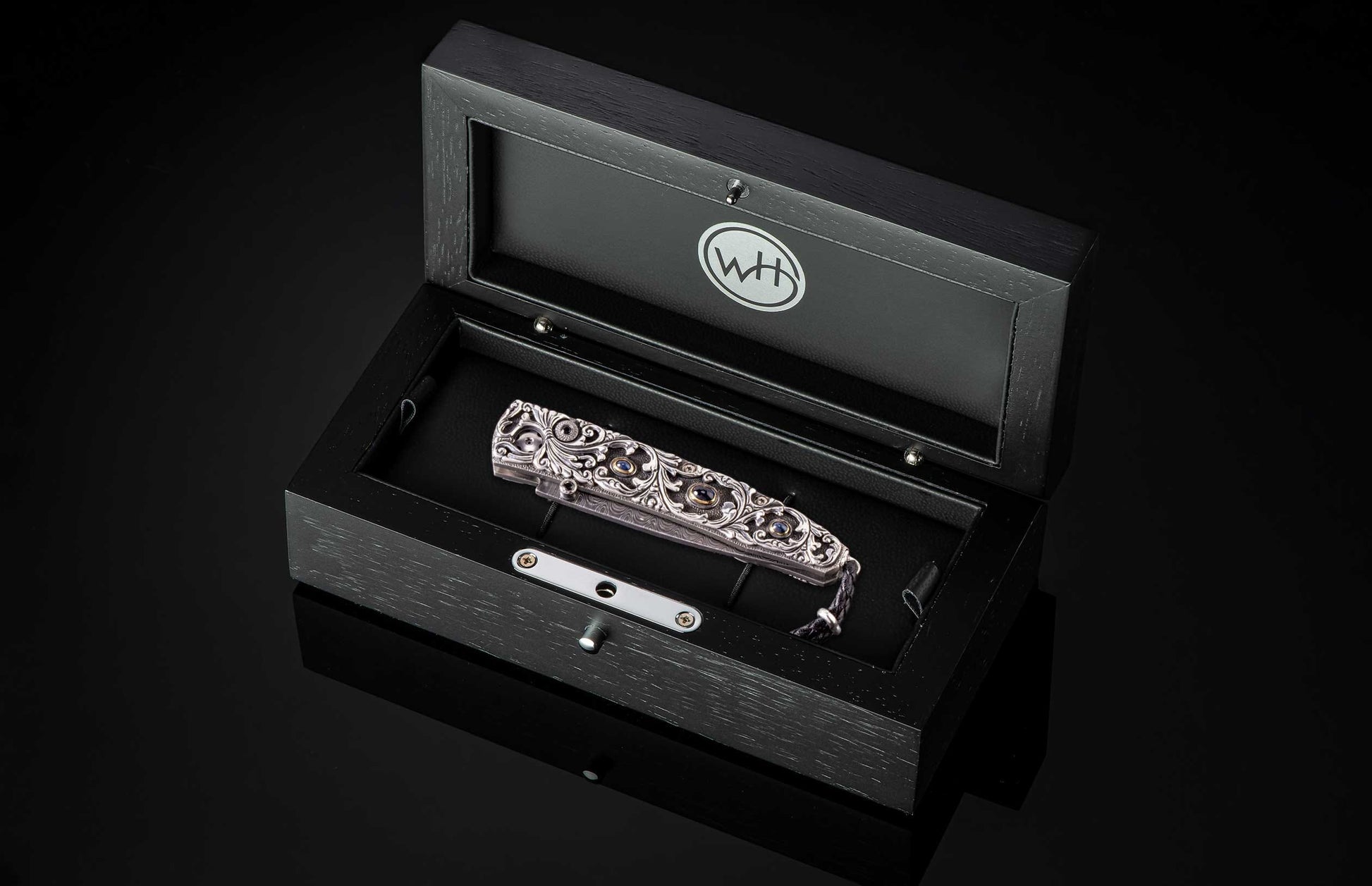 The Radiant Hand-Carved Sterling Silver Pocketknife in a case