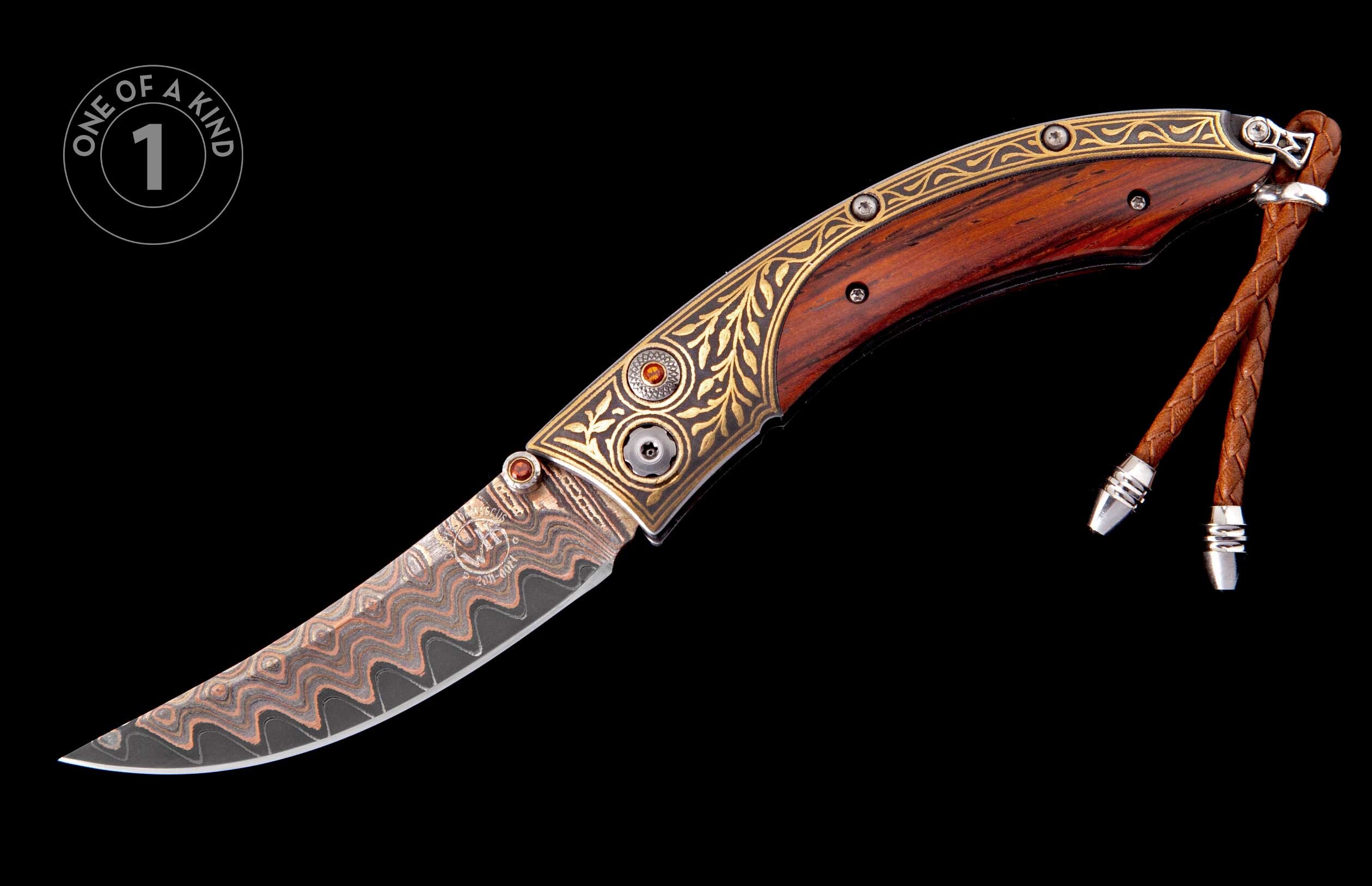 Ornate folding knife with a dark wood handle, gold scrollwork, amber gems, a patterned Damascus steel blade, and a braided leather lanyard.