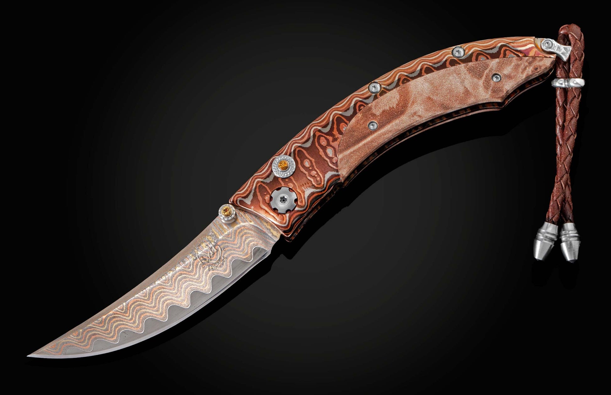 The Persian 'Range Fire' pocket knife from William Henry features a beautiful frame in 'Wave' Mokume Gane
