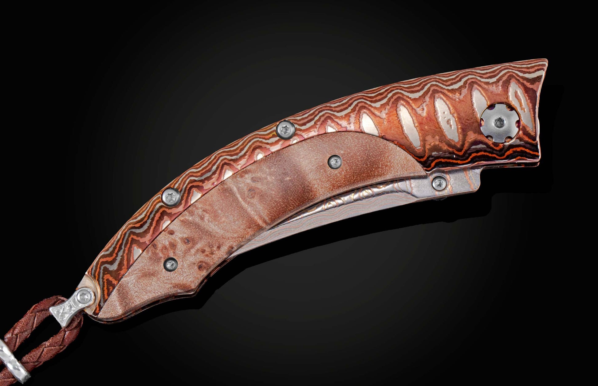  inlaid with maple burl wood. The blade is 'Copper Wave' Damascus steel with a VG5 core. The button lock and the thumb stud are set with citrine gems