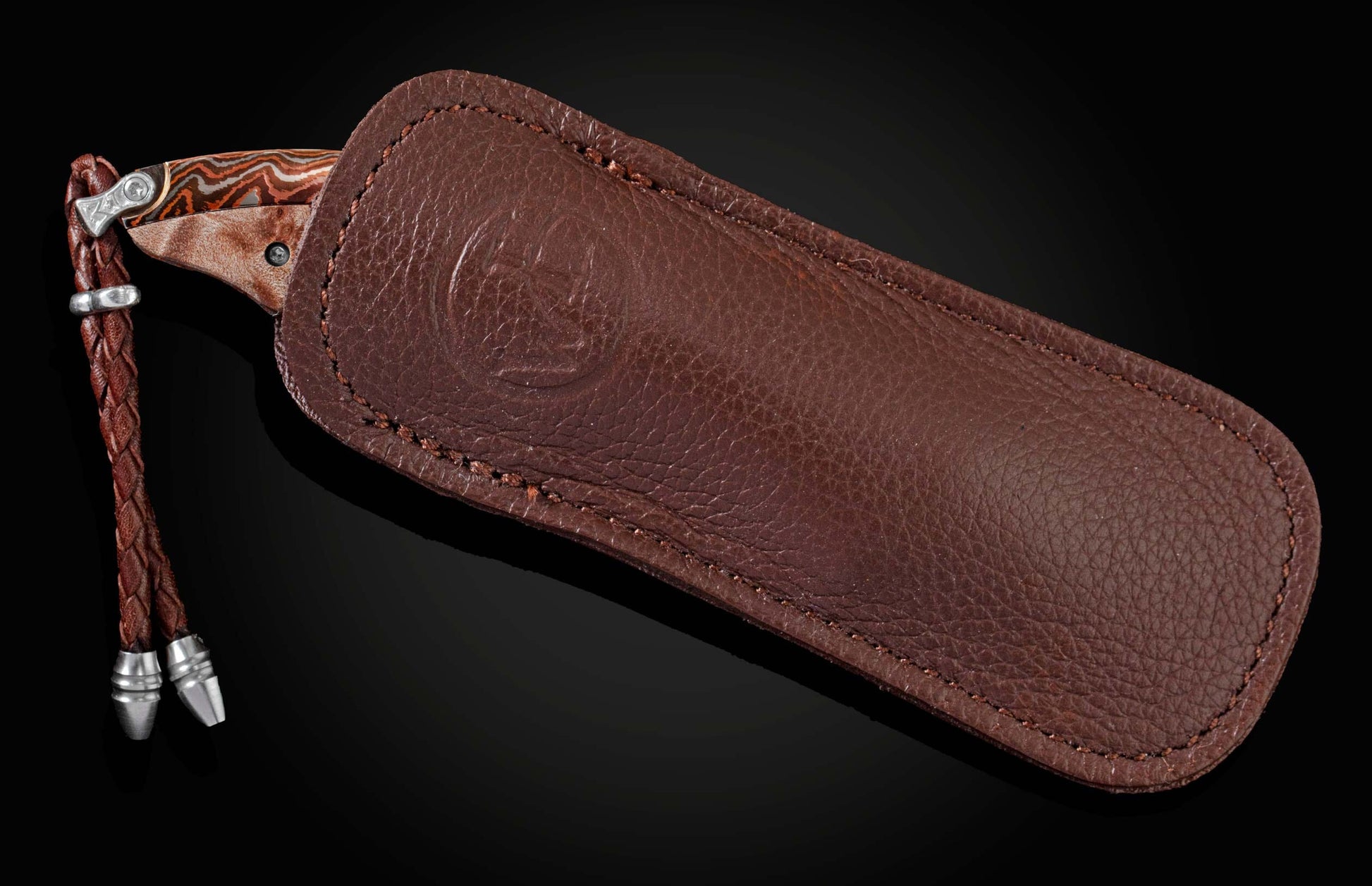 The Persian 'Range Fire' pocket knife from William Henry features a beautiful frame in 'Wave' Mokume Gane