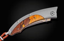 Handcrafted William Henry knife with titanium frame inlaid with yellow spalted beech wood scales