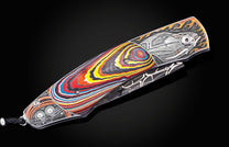  and 24K gold inlaid with Corvette Fordite and set with black diamonds. The blade is hand-forged damascus.