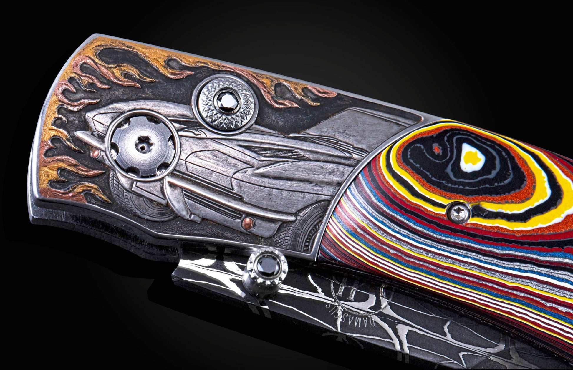 Handcrafted pocket knife from William Henry featuring hand-engraved images of 63' Corvette with copper