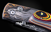 Handcrafted pocket knife from William Henry featuring hand-engraved images of 63' Corvette with copper