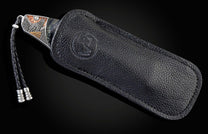  and a hand-forged Damascus steel blade by Zoe Crist