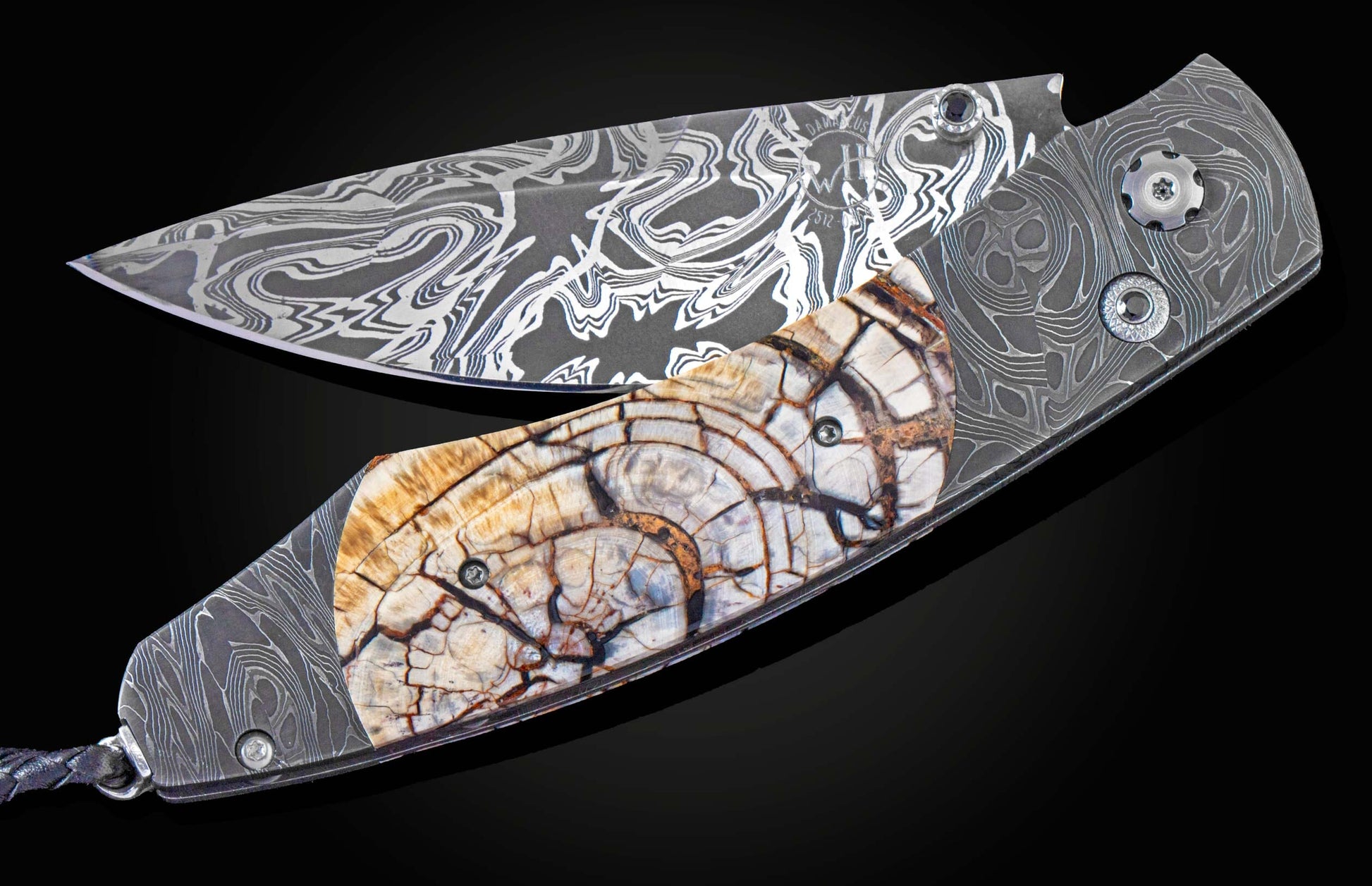 Handcrafted William Henry knife with hand-forged damascus steel frame by Chad Nichols, inlaid with fossil Woolly Mammoth tusk, spinel gemstones and a  damascus steel blade by Luke Mattern