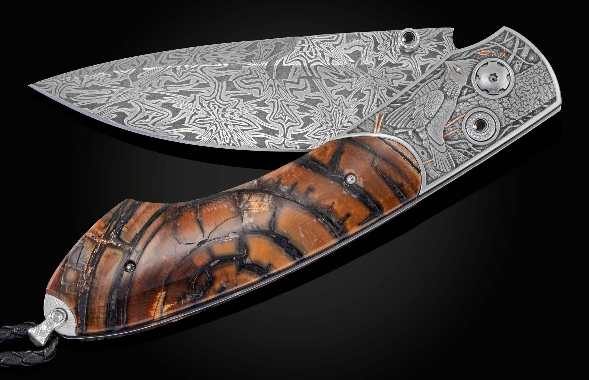 Candcrafted pocket knife from William Henry featuring hand-engraved grouse and quail with copper and 24K gold inlaid with fossil Woolly Mammoth tusk and set with spinel gem stones.. The blade is hand-forged damascus steel.