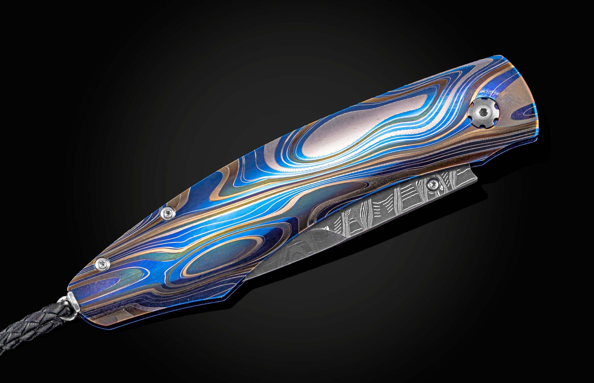 Custom knife from William Henry features a color laser-engraved titanium frame