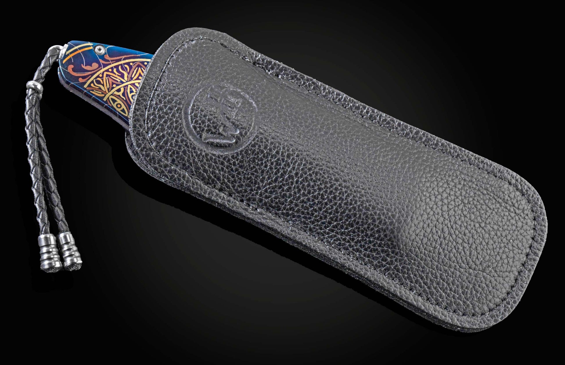 Handcrafted William Henry pocket knife features hand-forged and anodized blue damascus frame by Chad Nichols