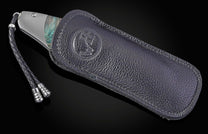 Handcrafted William Henry knife features a titanium frame