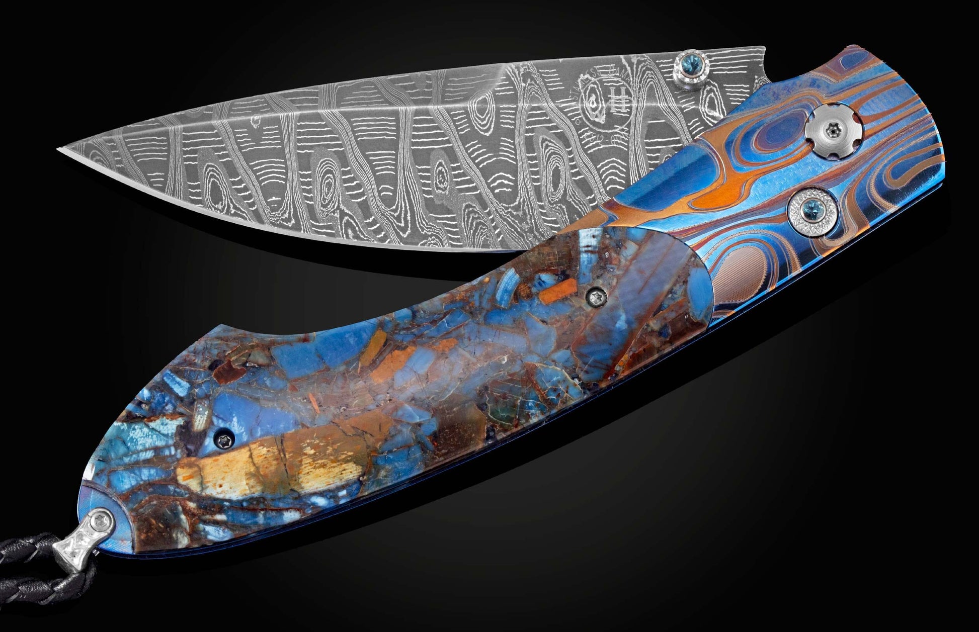 Handcrafted William Henry knife with laser etched titanium frame, inlaid with Mammoth Fusion scales, London Blue topaz gemstones, and a hand-forged damascus steel blade by Mike Norris