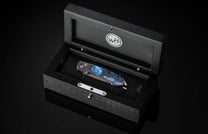 The Blue Fusion Pocketknife featuring Etched Damascus and Fossil Mammoth Tusk in a case