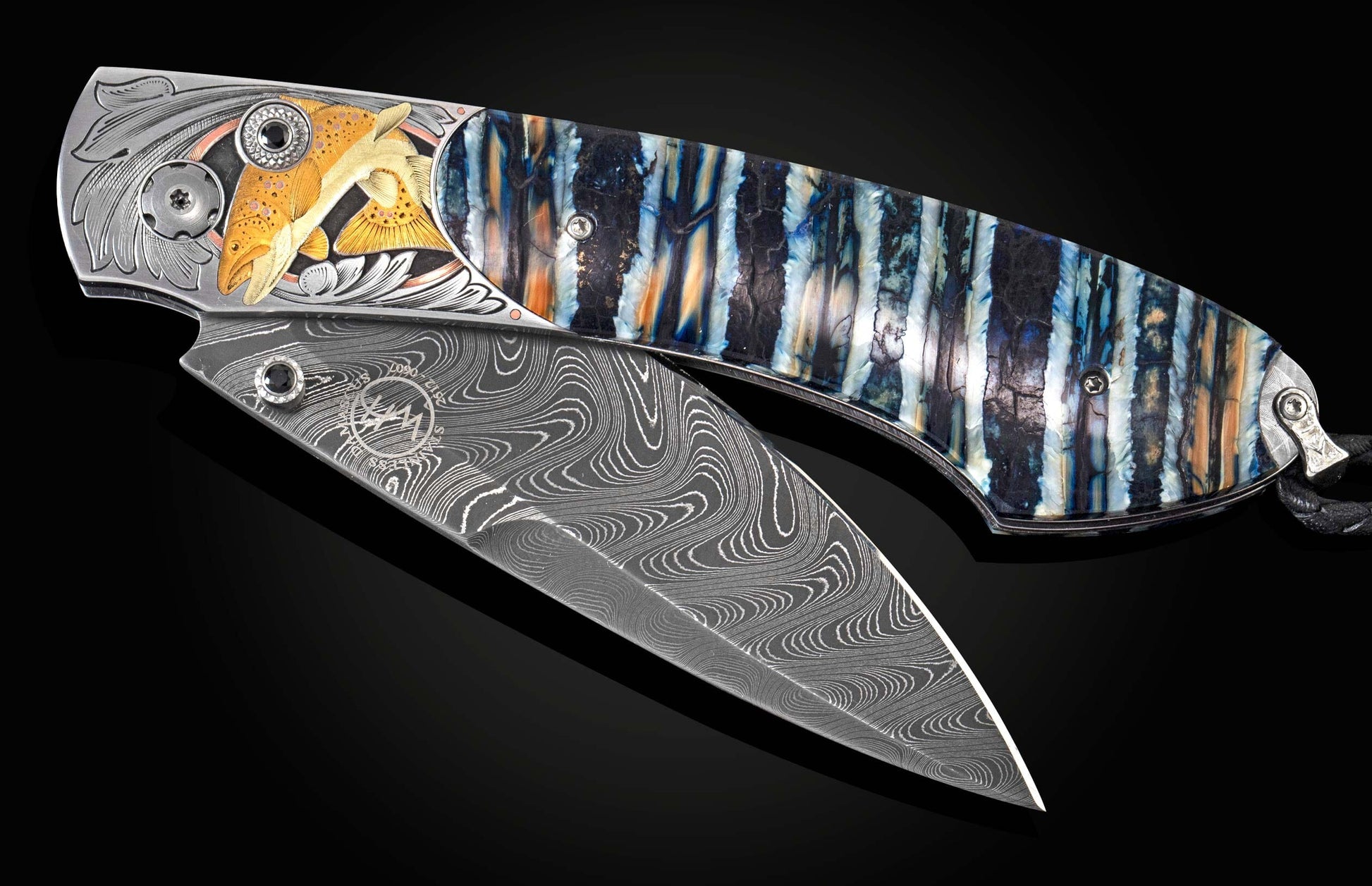 Handcrafted William Henry knife features hand-engraved bolsters with 24K yellow gold, 20K green gold, and copper inlays by Phil Bartolotta, fossil Woolly Mammoth tooth, spinel gemstones, and a hand-forged damascus steel blade by Chad Nichols
