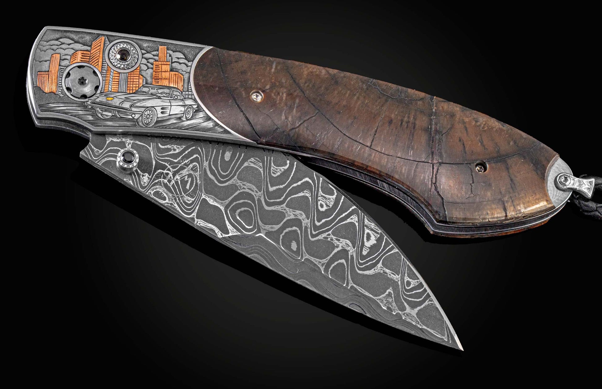 Handcrafted and hand-engraved knife from William Henry depicting a classic Corvette with 24K gold inlays by David He, fossil Woolly Mammoth tusk, spinel gem stones, and a hand-forged damascus steel blade by Chad Nichols