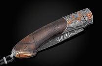  and a hand-forged damascus steel blade by Chad Nichols