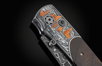 Handcrafted and hand-engraved knife from William Henry depicting a classic Corvette with 24K gold inlays by David He