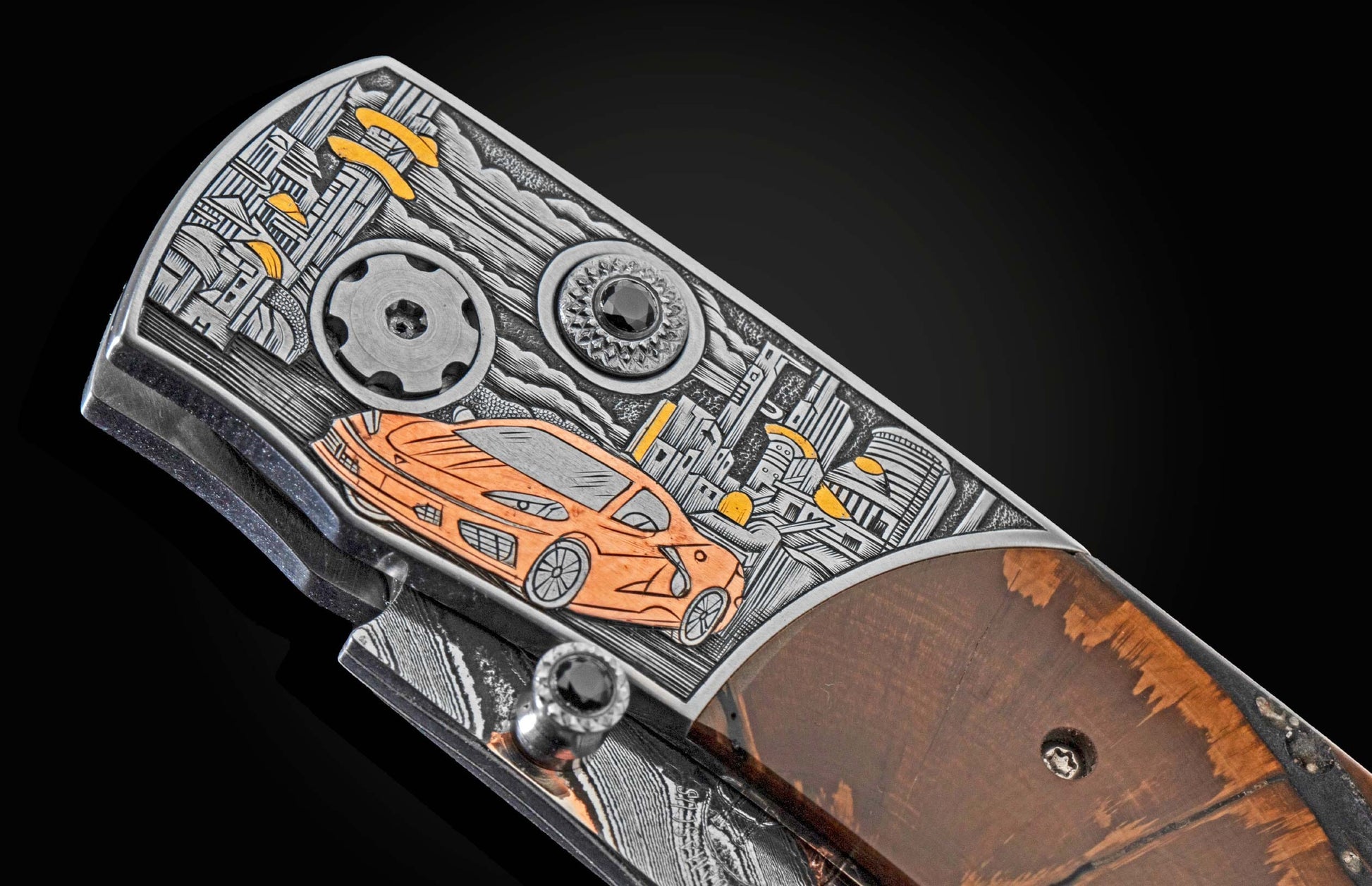 Handcrafted William Henry knife with hand-engraved bolster in copper and 24K gold inlays by David He showing a Corvette and cityscape