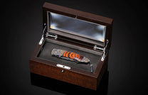 Handcrafted pocket knife from William Henry features hand-forged damascus
