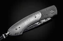  and set with black diamonds.