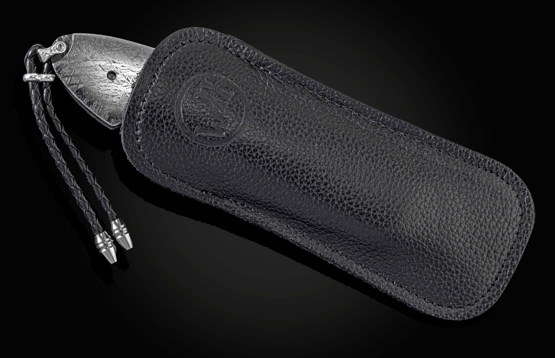 Handcrafted pocket knife from William Henry with a frame of hand-forged 'Twist' Damascus by Chad Nichols