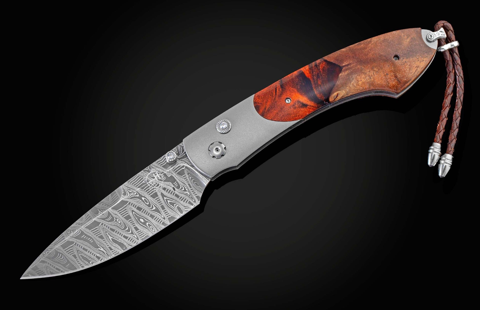 Handcrafted William Henry knife featuring a titanium frame
