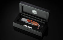  white topaz gemstones and a hand-forged damascus steel blade by Mike Norris