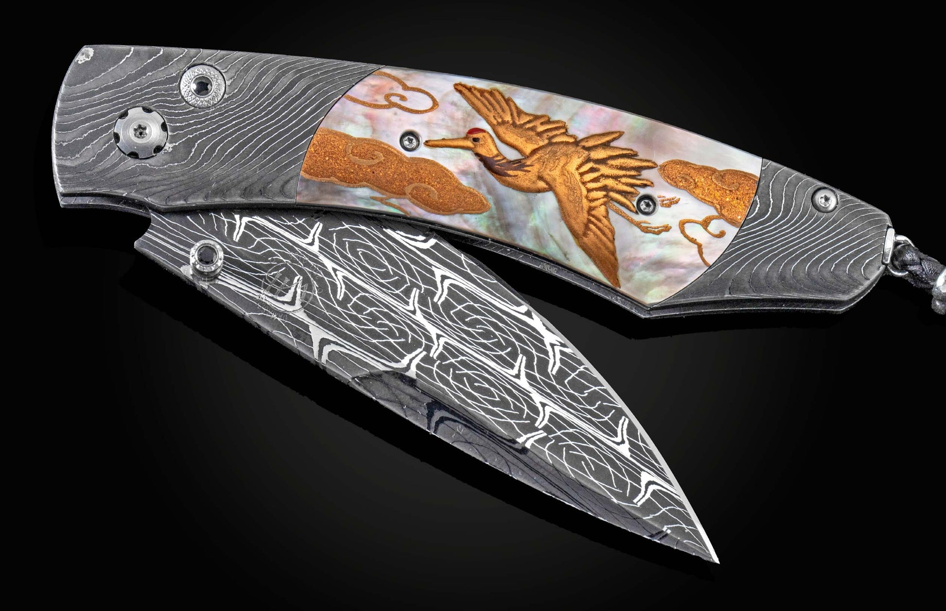 Handcrafted William Henry knife with hand forged Damascus frame by Chad Nichols, inlaid with a black lip pearl scale embellished with a gold Maki-e crane design, spinel gemstones, and a hand-forged Damascus steel blade by Robert Eggerling