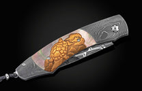  and a hand-forged Damascus steel blade by Robert Eggerling