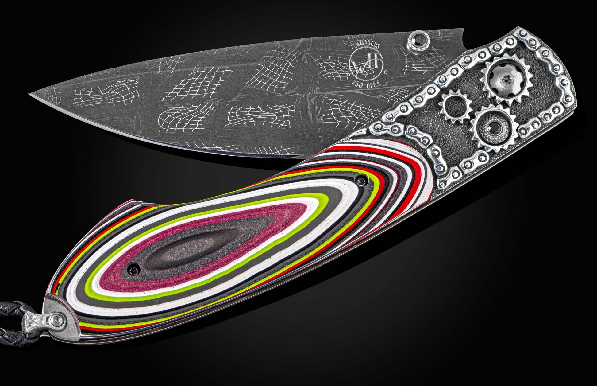Handcrafted William Henry knife with hand-carved sterling silver framr by Lee Downey, inlaid with Fordite scales, spinel gemstones, and a hand-forged Checkerd Flag damascus steel blade by Chad Nichols