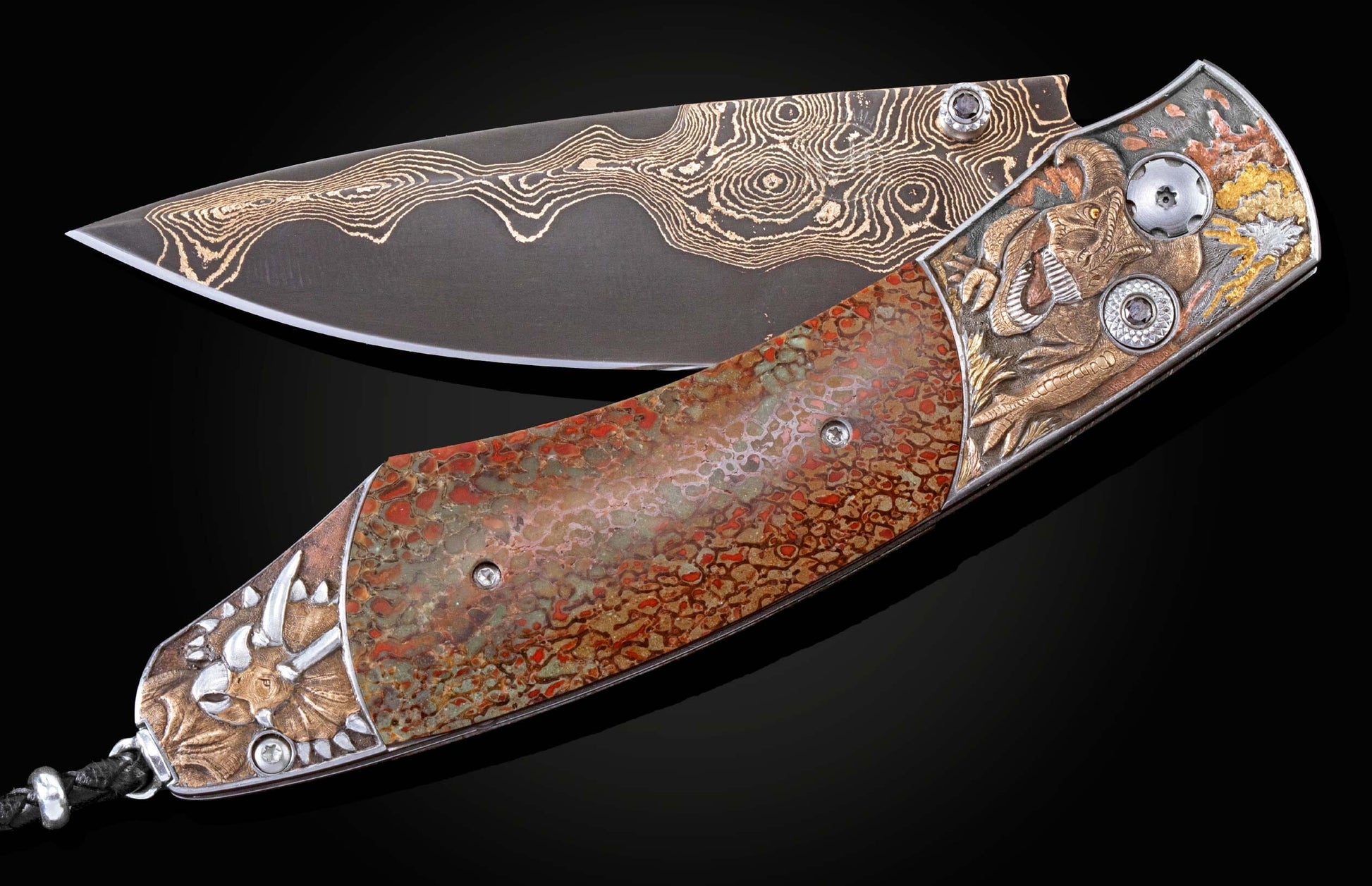 Handcrafted pocket knife from William Henry features hand-engraved images of dinosaurs with copper, silver, brass, bronze, and 24K & 18K gold, inlaid with fossil dinosaur bone and set with black diamonds. The blade is 'Bronze Mai' damascus steel.