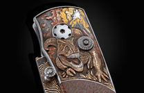  inlaid with fossil dinosaur bone and set with black diamonds. The blade is 'Bronze Mai' damascus steel.
