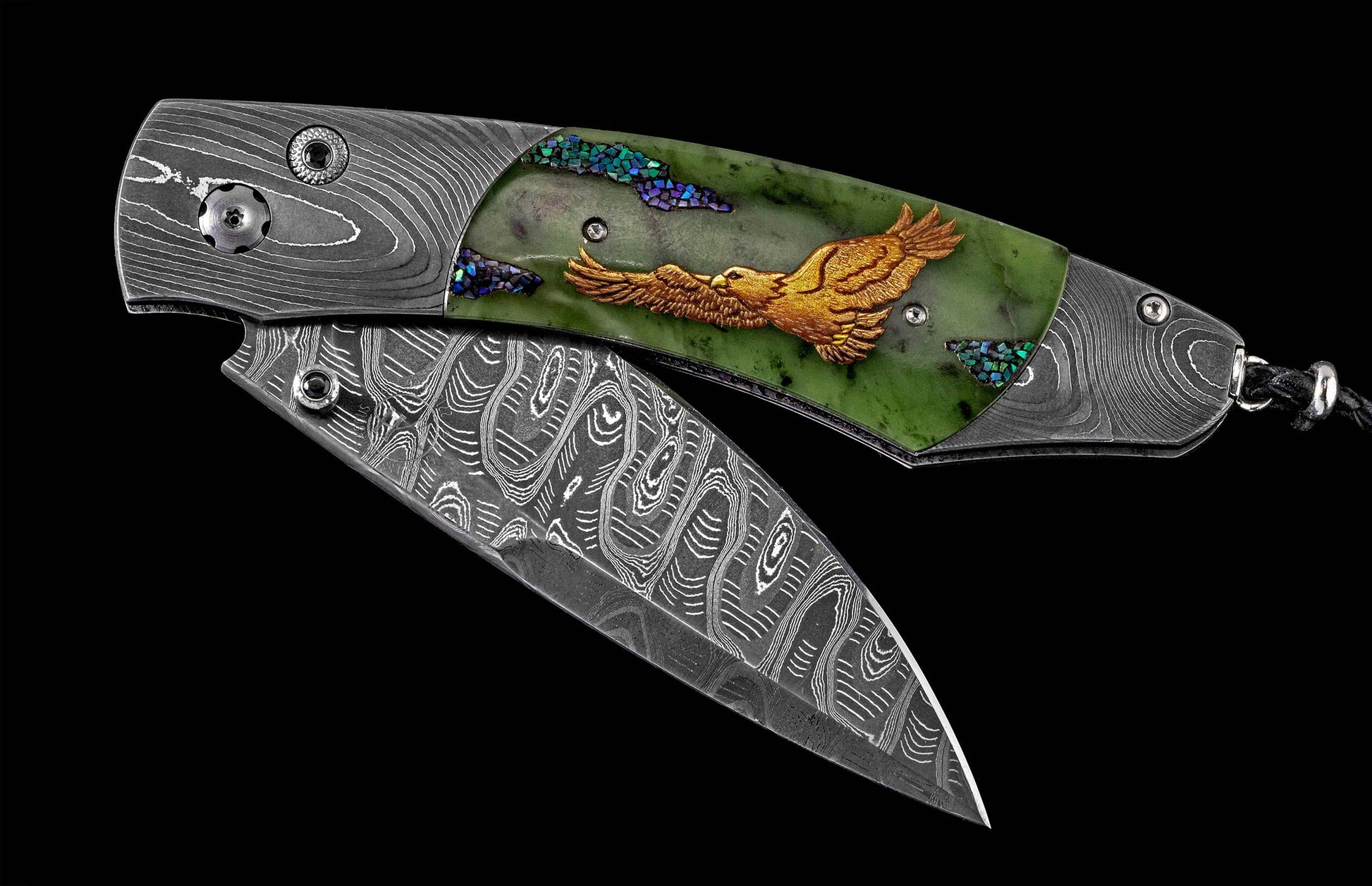 Partially open Damascus steel folding knife with a green stone handle, featuring a gold-toned eagle inlay and iridescent crushed stone accents.
