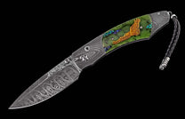 Ornate folding knife with a Damascus steel blade, green stone handle featuring a gold eagle, iridescent accents, and a braided leather lanyard.