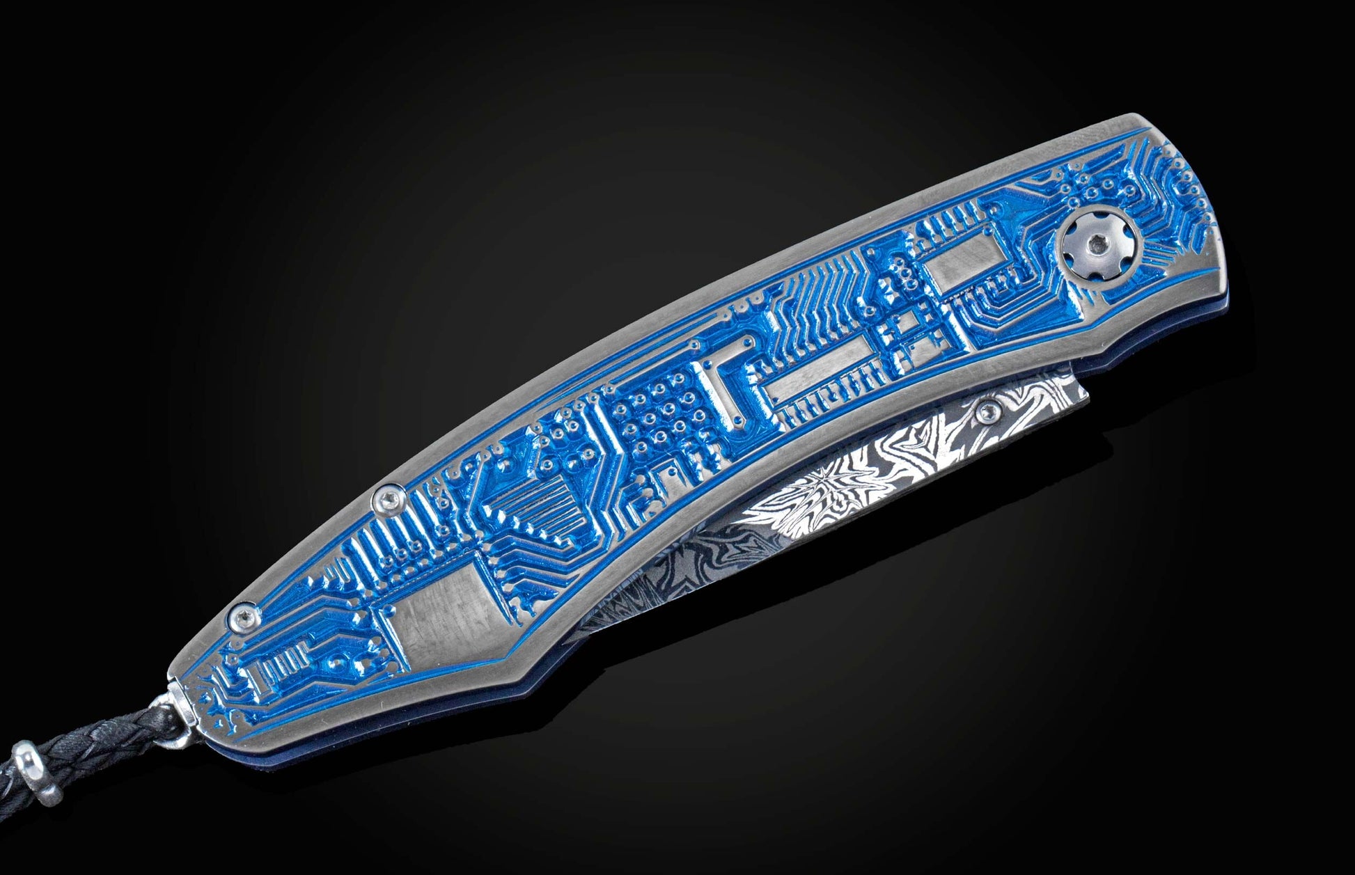 Custom knife from William Henry featuring an anodized titanium handle with high detail micro machining depicting circuitry