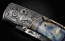 Custom William Henry knife with hand-engraved scenes of elk with copper and 24K gold inlays by Howard Thomas